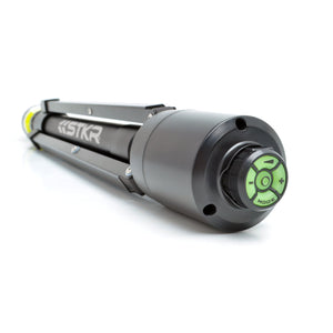 Folded up FLi-Pro Plus 10' Telescoping Area Light. camera focused on the bottom of the tripod showing us the magnetically attached FLi wireless remote..