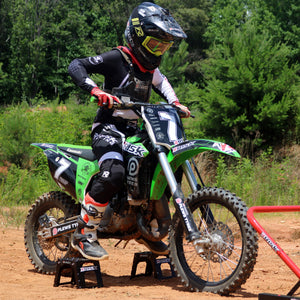 Youth MX racer utilizing the Adjustable Motocross Starting Blocks while practicing his moto starts.