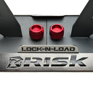 Close-up of a metallic surface with red knobs and 'Lock-N-Load' branding.