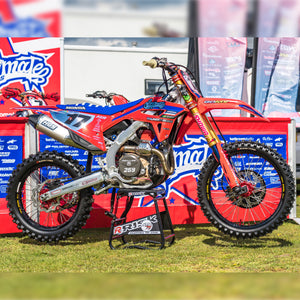 Honda dirt bike sitting on a Risk Racing ATS Stand and is wearing Plews Tyres