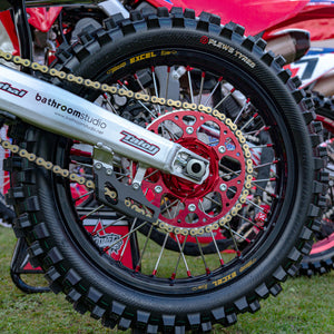 Multiple motocross bikes in a line with a close up shot of the rear tire of the 1st one highlighting the Plews Tyres MX2 Matterly GP