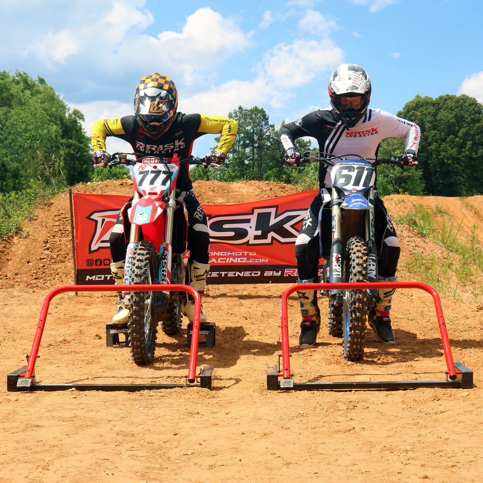 Holeshot Pro Starting Gate Electronic Version on a white studio background with a hand holding the wireless remote control