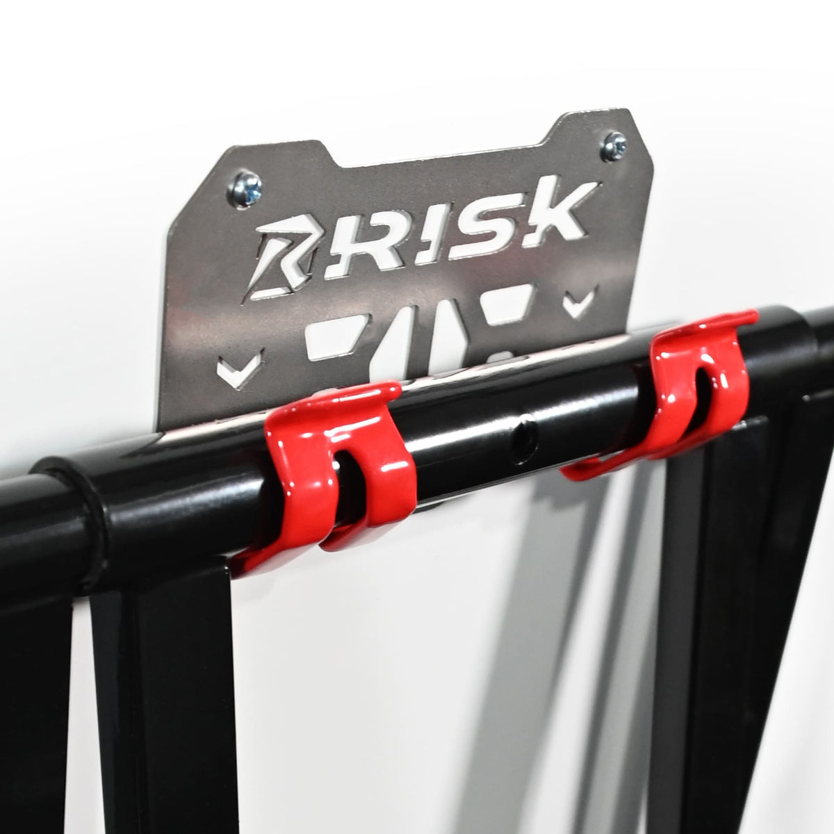 closeup of an RR1 hanging from RR1 wall mount on white. Risk logo clearly visible.