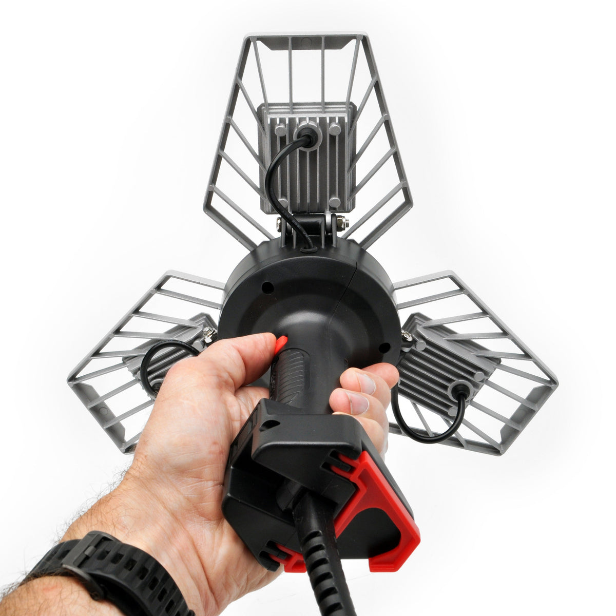 TRiLIGHT Shoplight V2 3-quarter back view showing off hanging hook and backside of LED panels with an offscreen hand holding the light